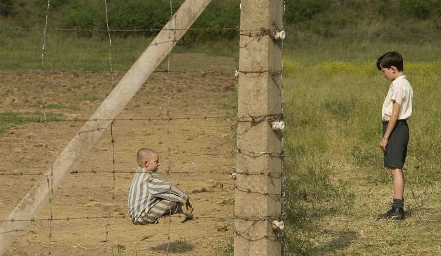 US] The Boy in the Striped Pajamas (2008): When his family moves from  Berlin to Poland, a young boy befriends a boy who lives on the other side  of the fence, unaware